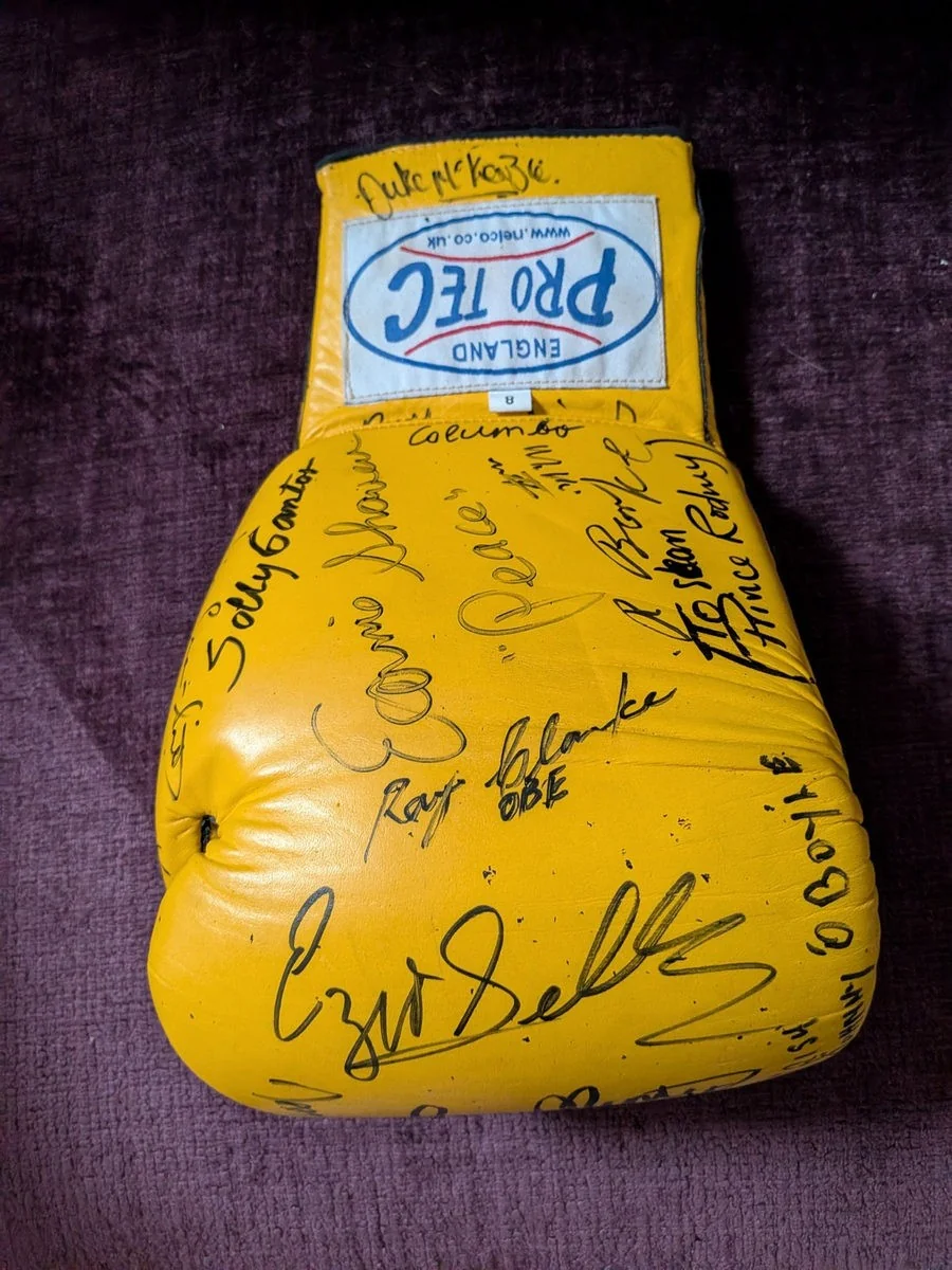 Multi-signed Pro-Tec gloves associated with former-boxers’ gatherings.