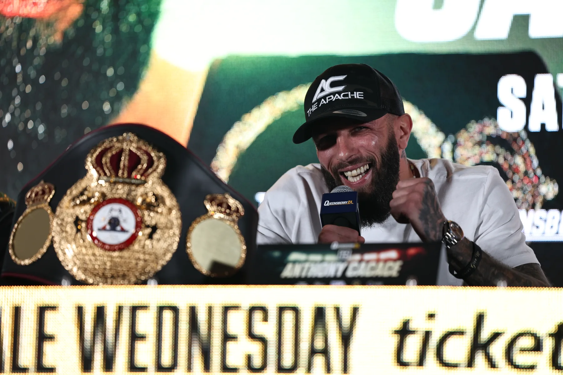 Anthony Cacace speaks at the launch press conference with his WBA championship belt on display.